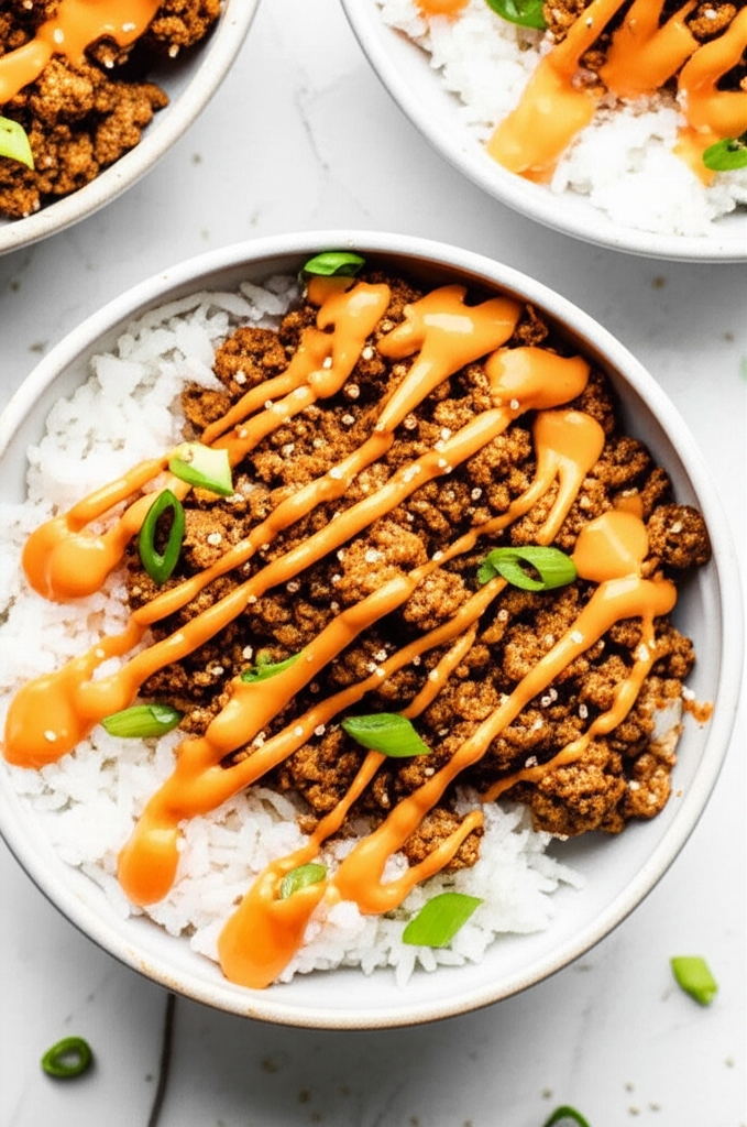 Bang bang sauce on ground turkey rice bowls
